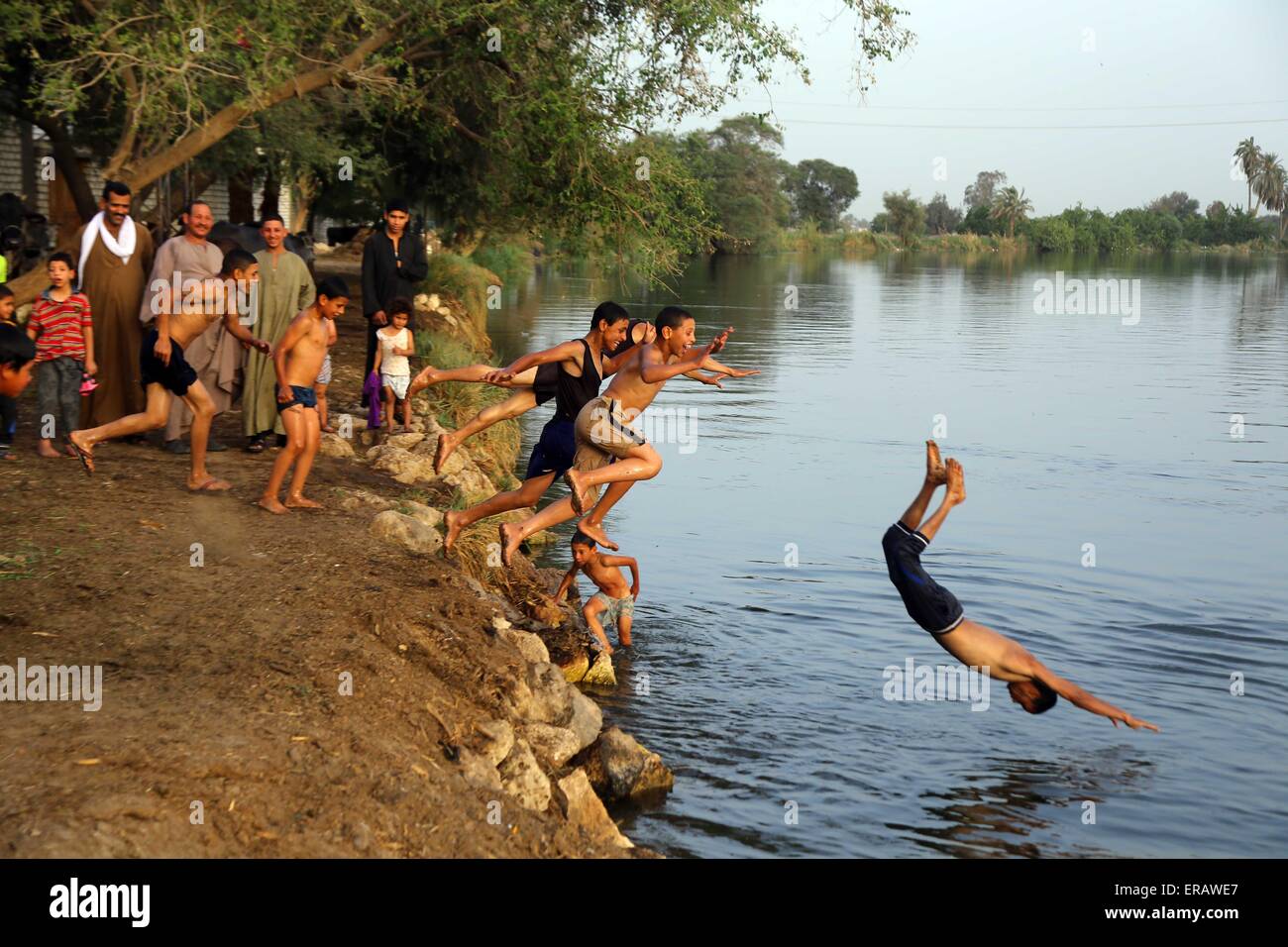 Beijing, Egypt. 27th May, 2015. Egyptians boys play in the Nile River in Al Minya Governorate, Egypt, on May 27, 2015. © Ahmed Gomaa/Xinhua/Alamy Live News Stock Photo