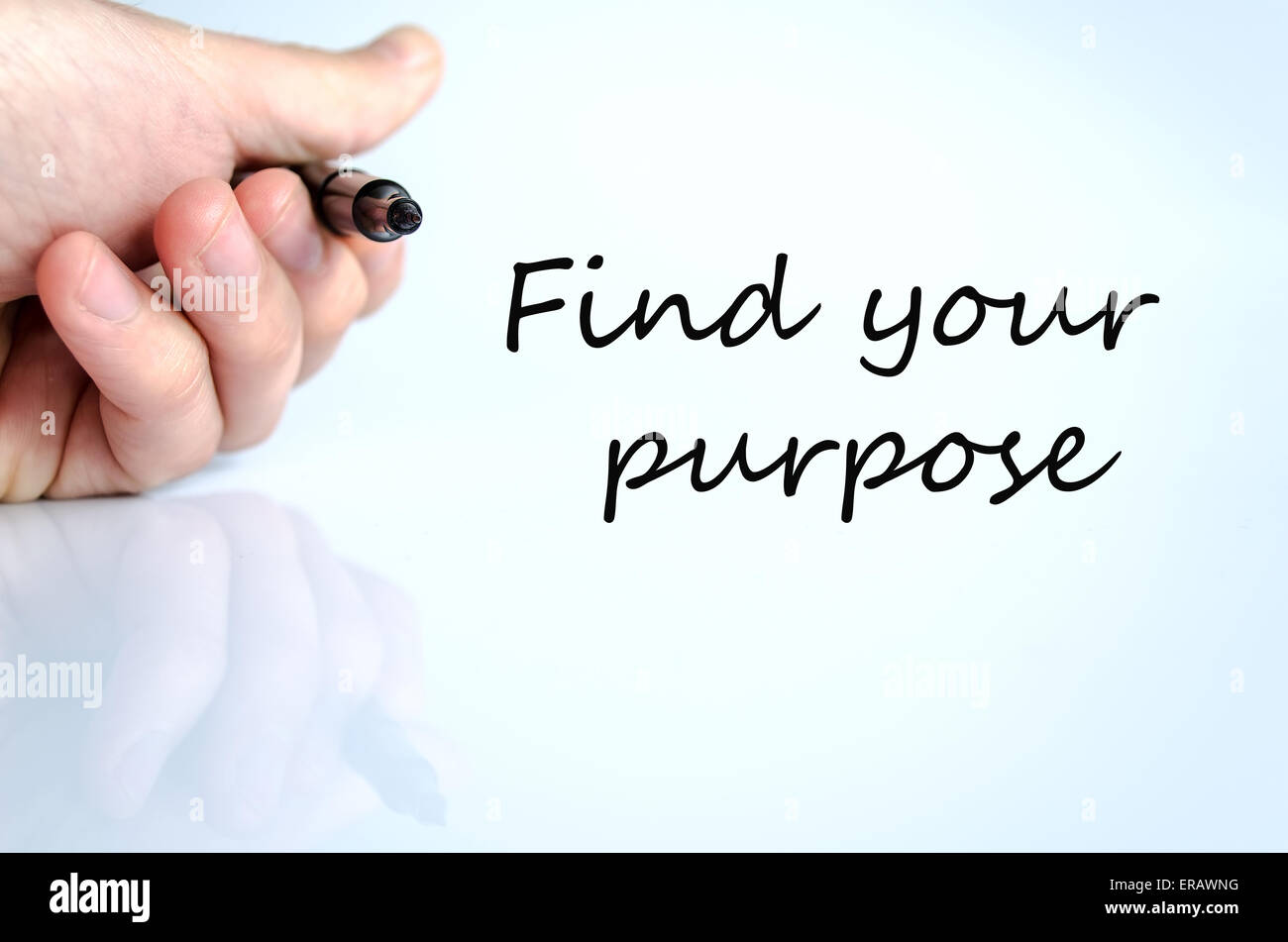 Pen in the hand isolated over white background Find your purpose concept Stock Photo