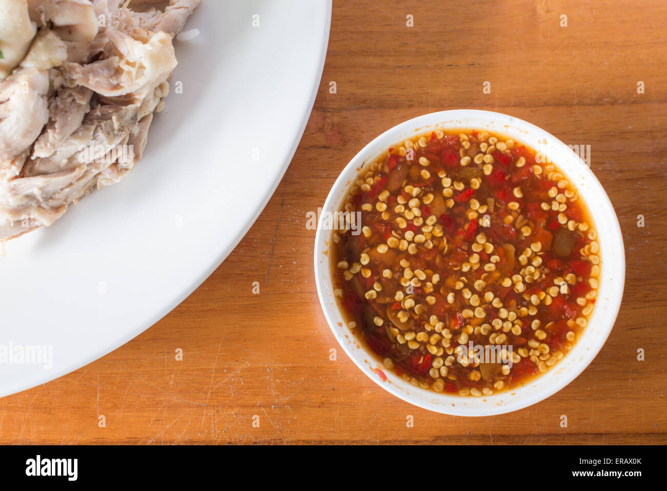 Eat spicy sauce with boiled chicken. Stock Photo