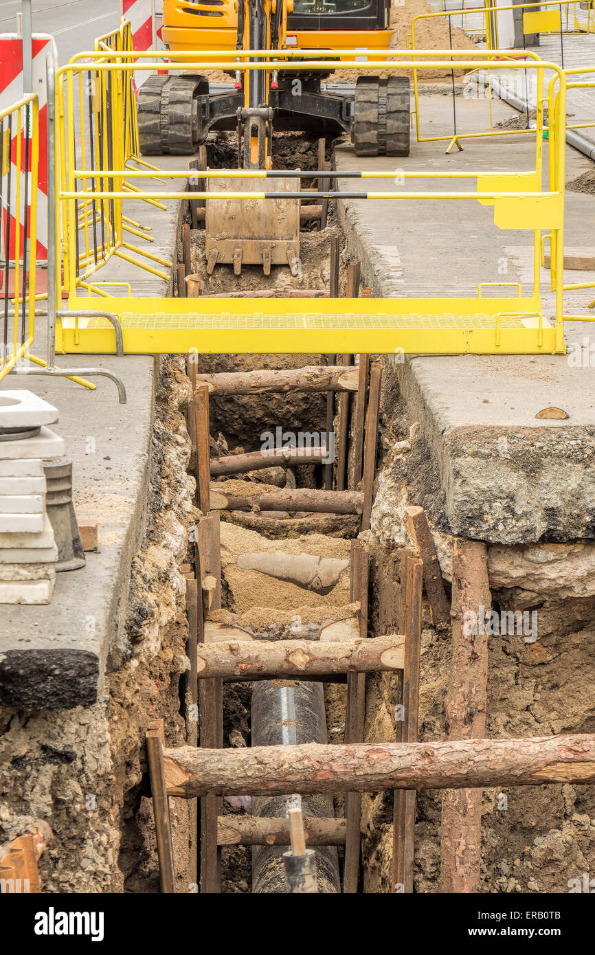 Big trench in city, utility repair. Stock Photo