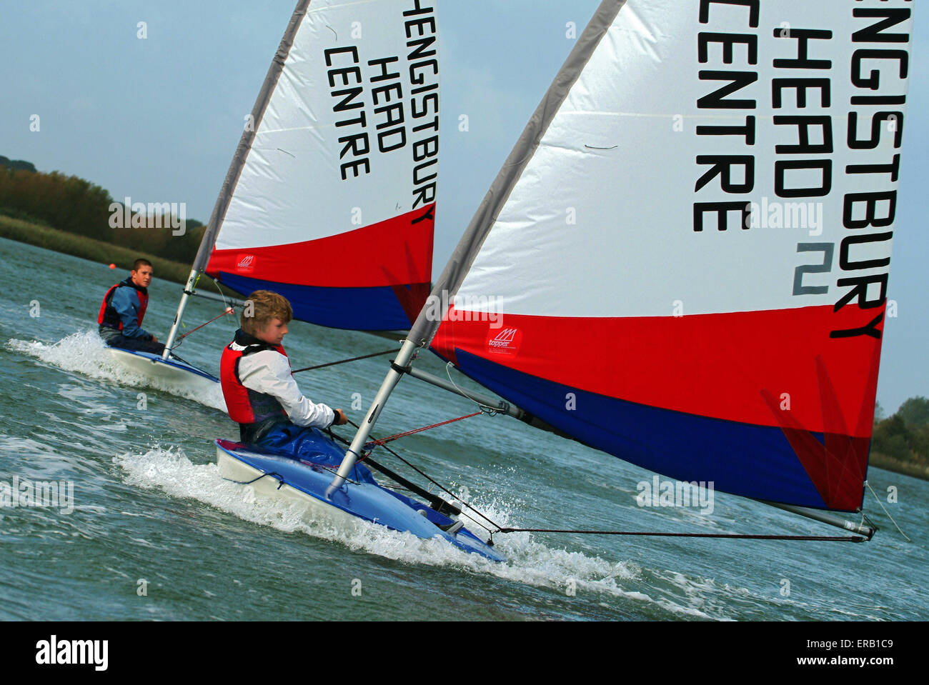 Youngsters sailing Topper dinghies at Hengistbury Head Centre, Dorset