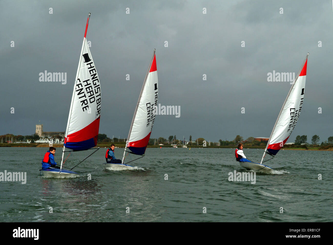 Youngsters sailing Topper dinghies at Hengistbury Head Centre, Dorset