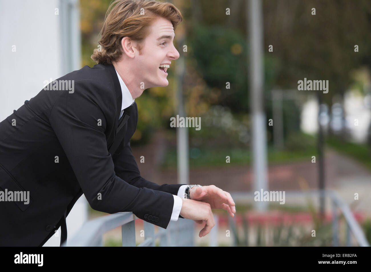 portrait of a handsome businessman in a black suit smiling Stock Photo ...