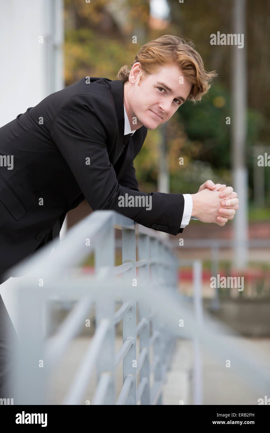 portrait of a handsome businessman in a black suit smiling Stock Photo ...