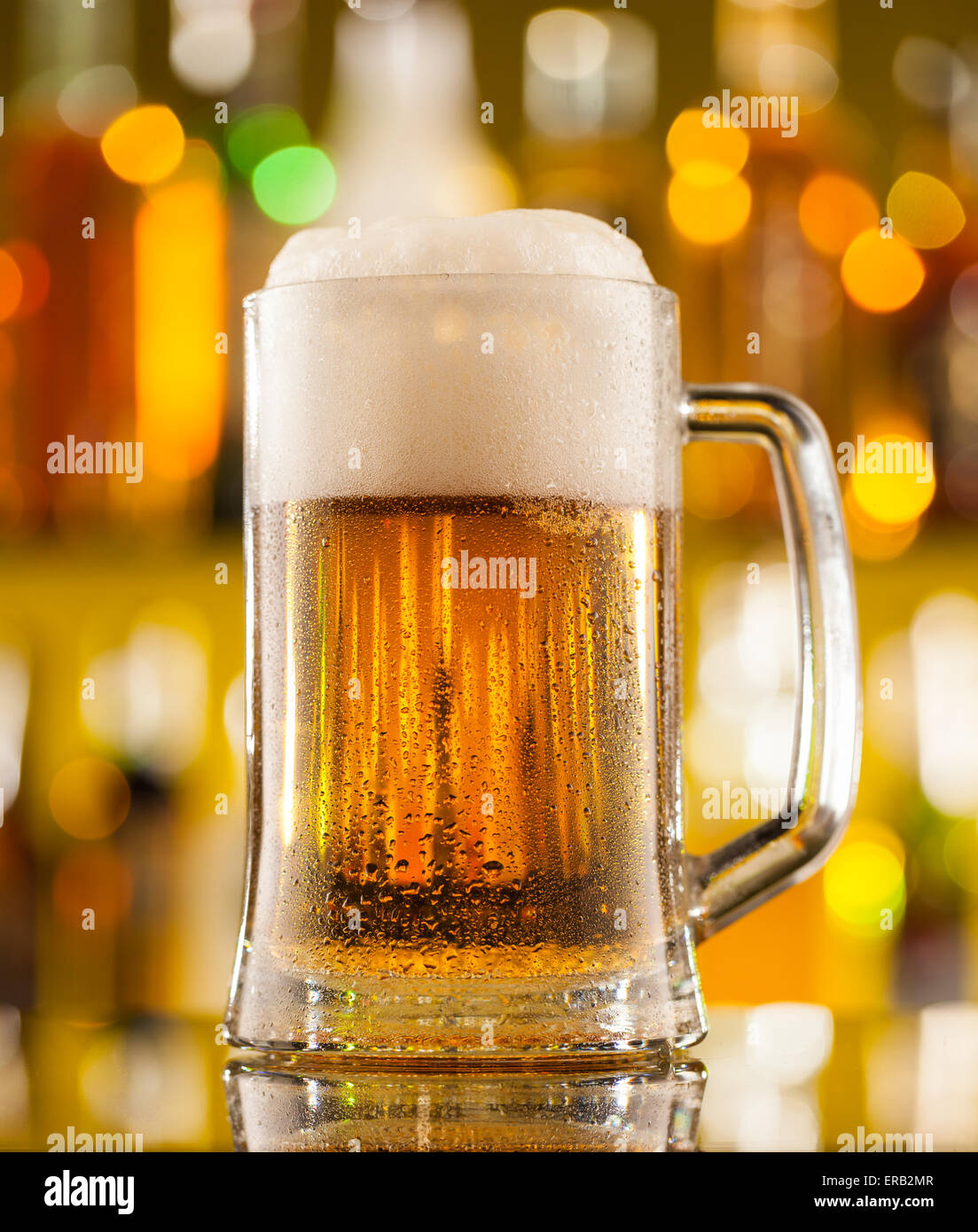 Jug of beer placed on bar counter Stock Photo