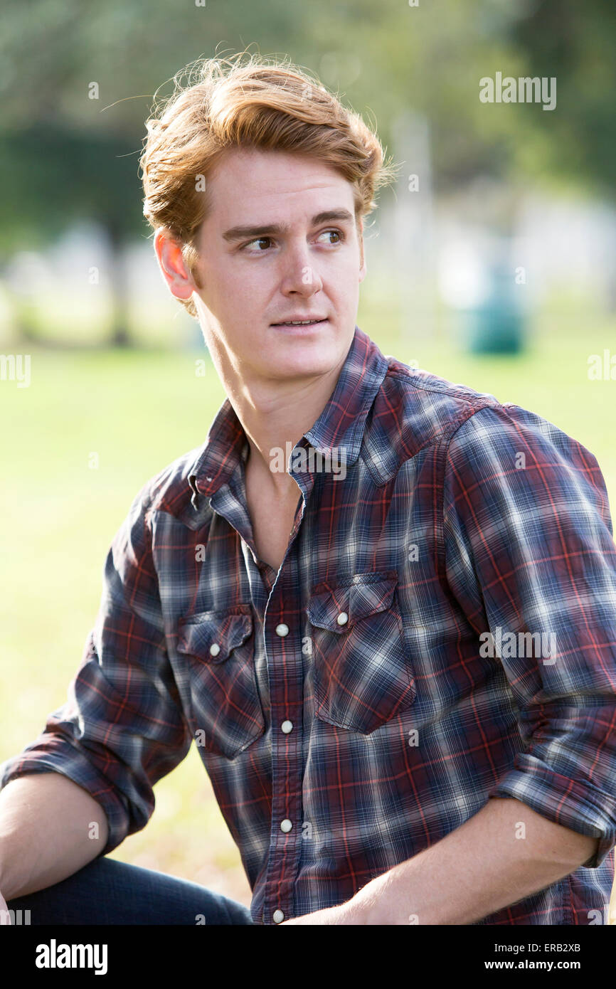 portrait of a handsome man in a flannel shirt Stock Photo Alamy