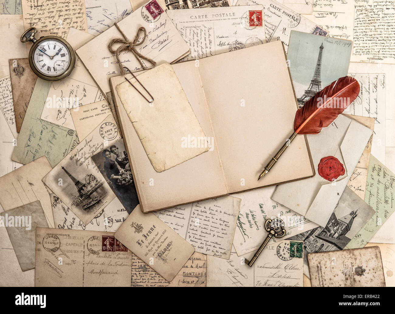 Open diary book, old accessories and postcards. Sentimental vintage style background Stock Photo