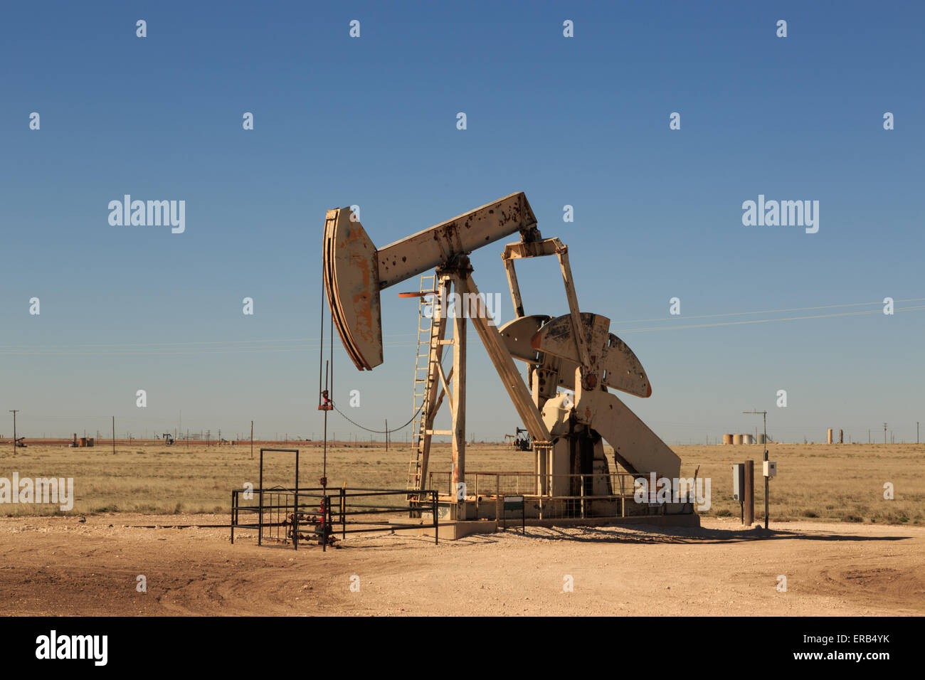 A photograph of working inland oil pump (oil donkey, nodding donkey) in
