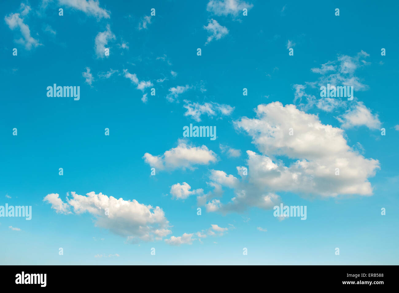 Turquoise blue sky with white clouds. Nature background. Environment concept Stock Photo