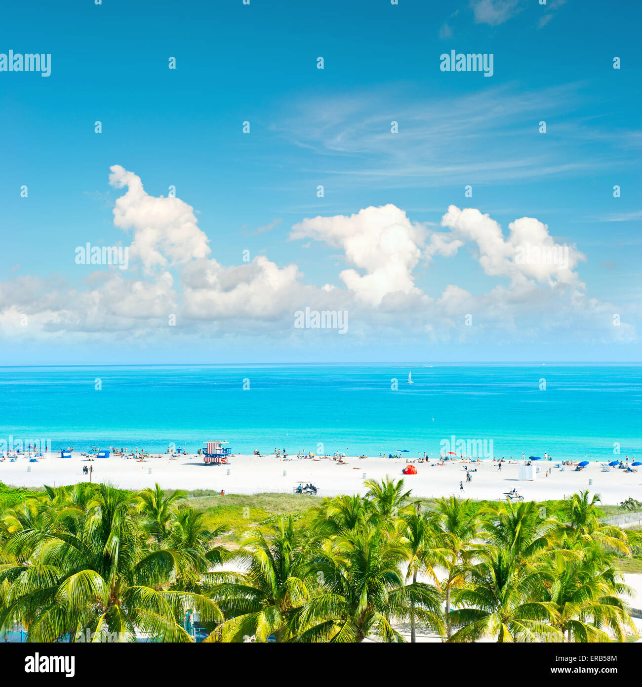 Blue sky, turquoise water and palm trees. Public beach in Miami Beach, Ocean Drive. Panoramic view Stock Photo