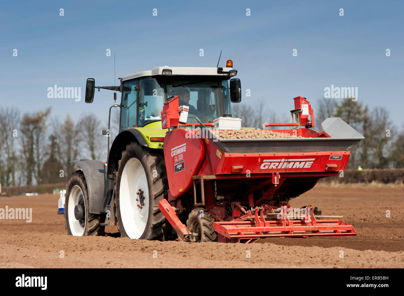 Tractor and potato planting machine hires stock photography and images
