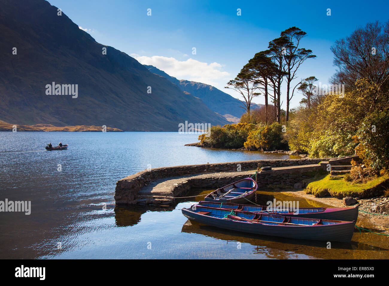 Beautiful little harbour with boats. Doo Lough / Doolough pass on the R335 road. County Mayo, Republic of Ireland. Connaught. Stock Photo