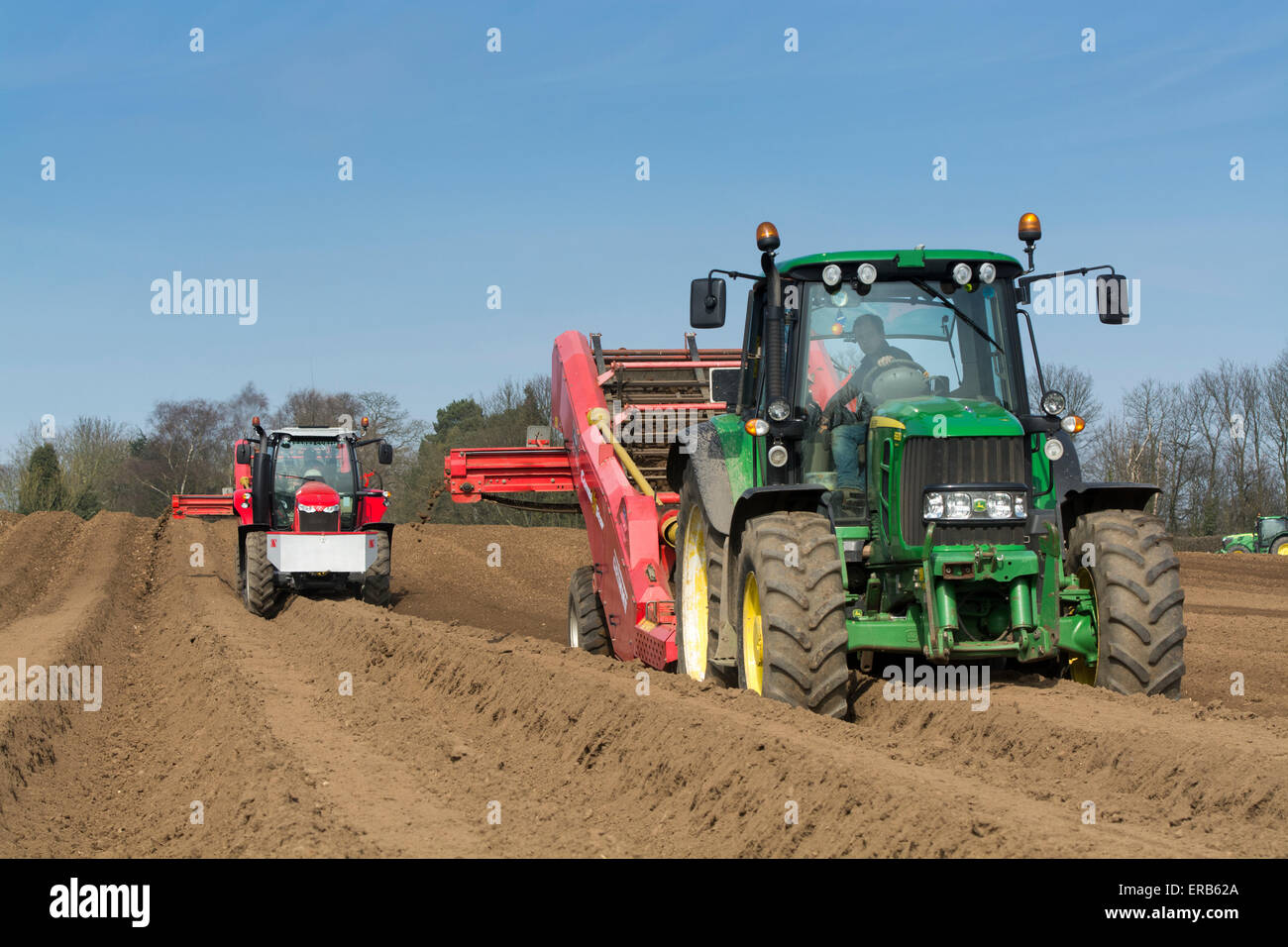 Preparing potato seed bed, using Grimme stone removing machine pulled by a John Deere 6930, Yorkshire, UK. Stock Photo