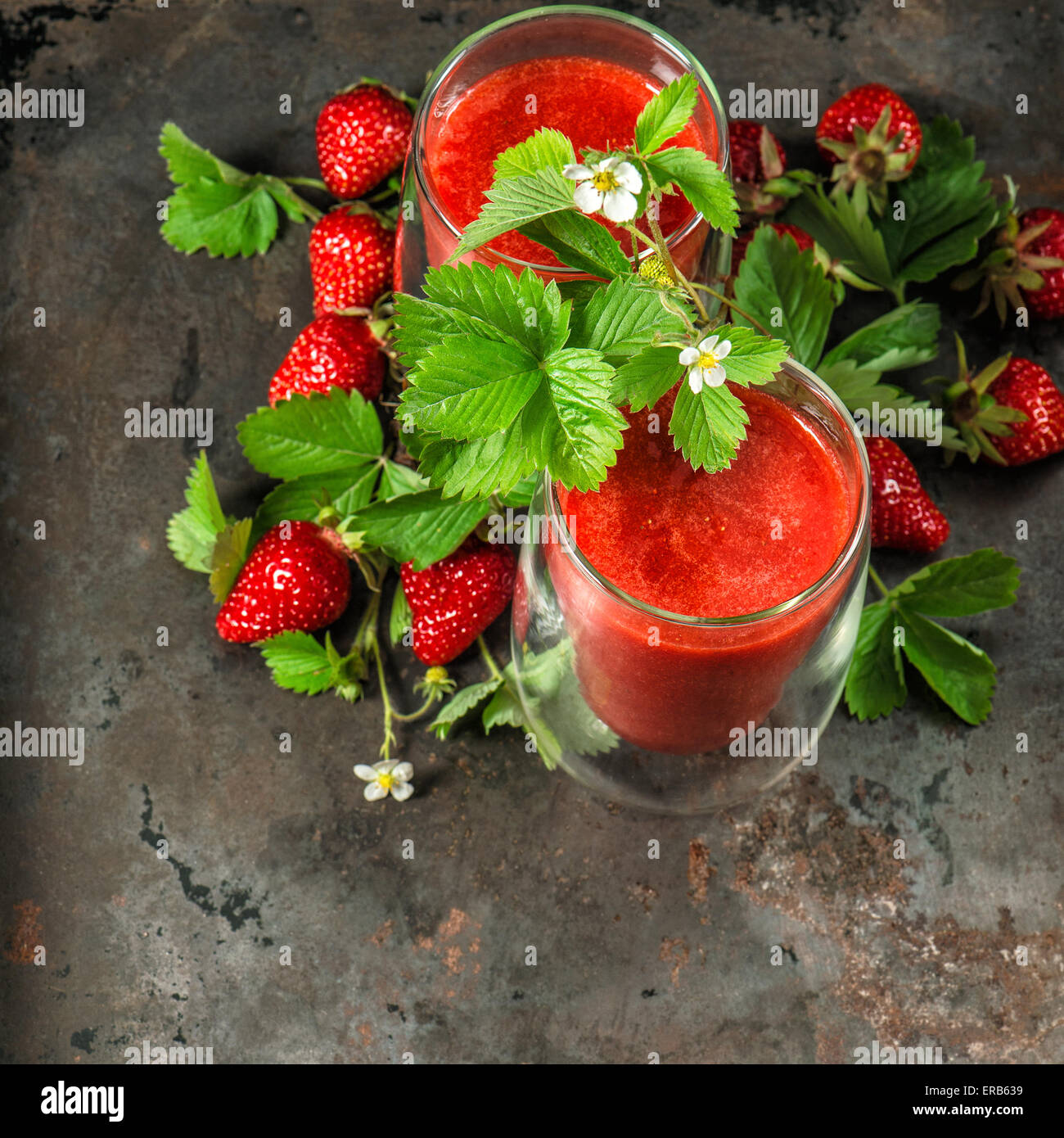 Mason Jar Mugs With Fresh Berry Smoothies And Fresh Strawberries And  Raspberries On A Gray Stone Or Slate Background. The Concept Of Proper  Nutrition And Health Or Detoxification. Stock Photo, Picture and