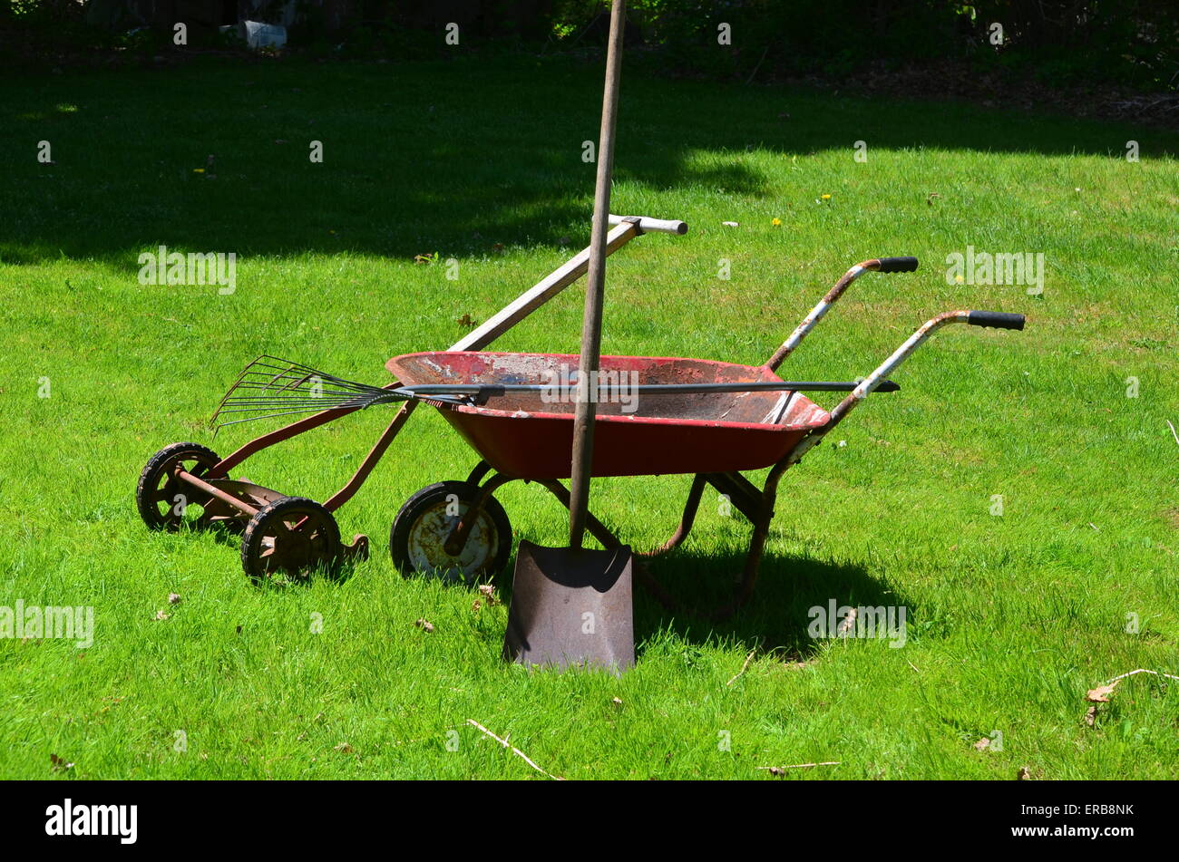 Mowershovelrake And Wheelbarrow Stock Photo Alamy