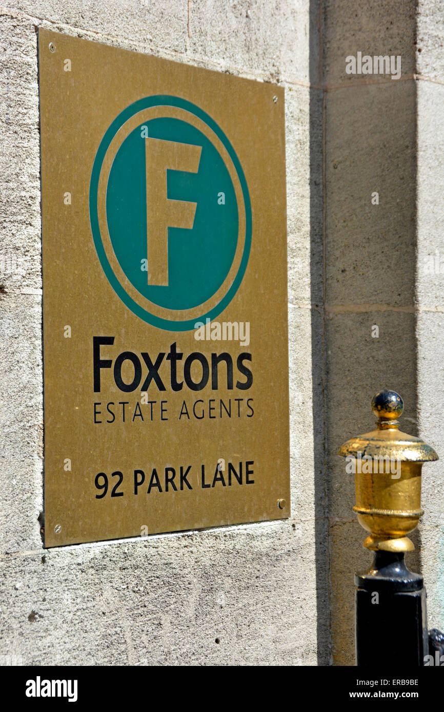 Foxtons estate agents sign outside branch premises in Park Lane London England UK Stock Photo