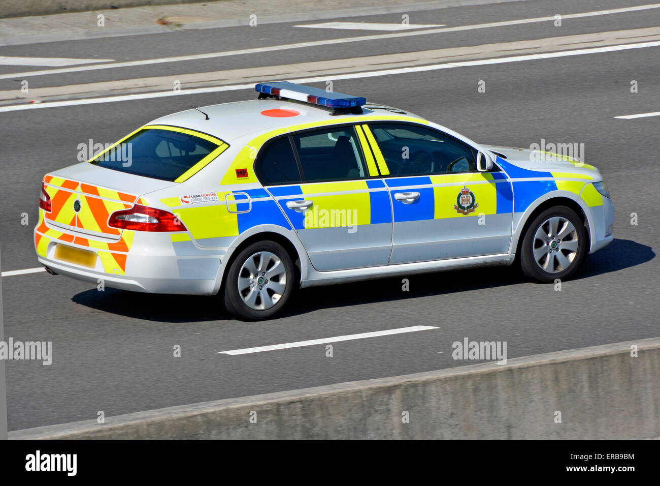 UK Military Police marked police patrol car driving along M25 motorway road Essex England UK Stock Photo