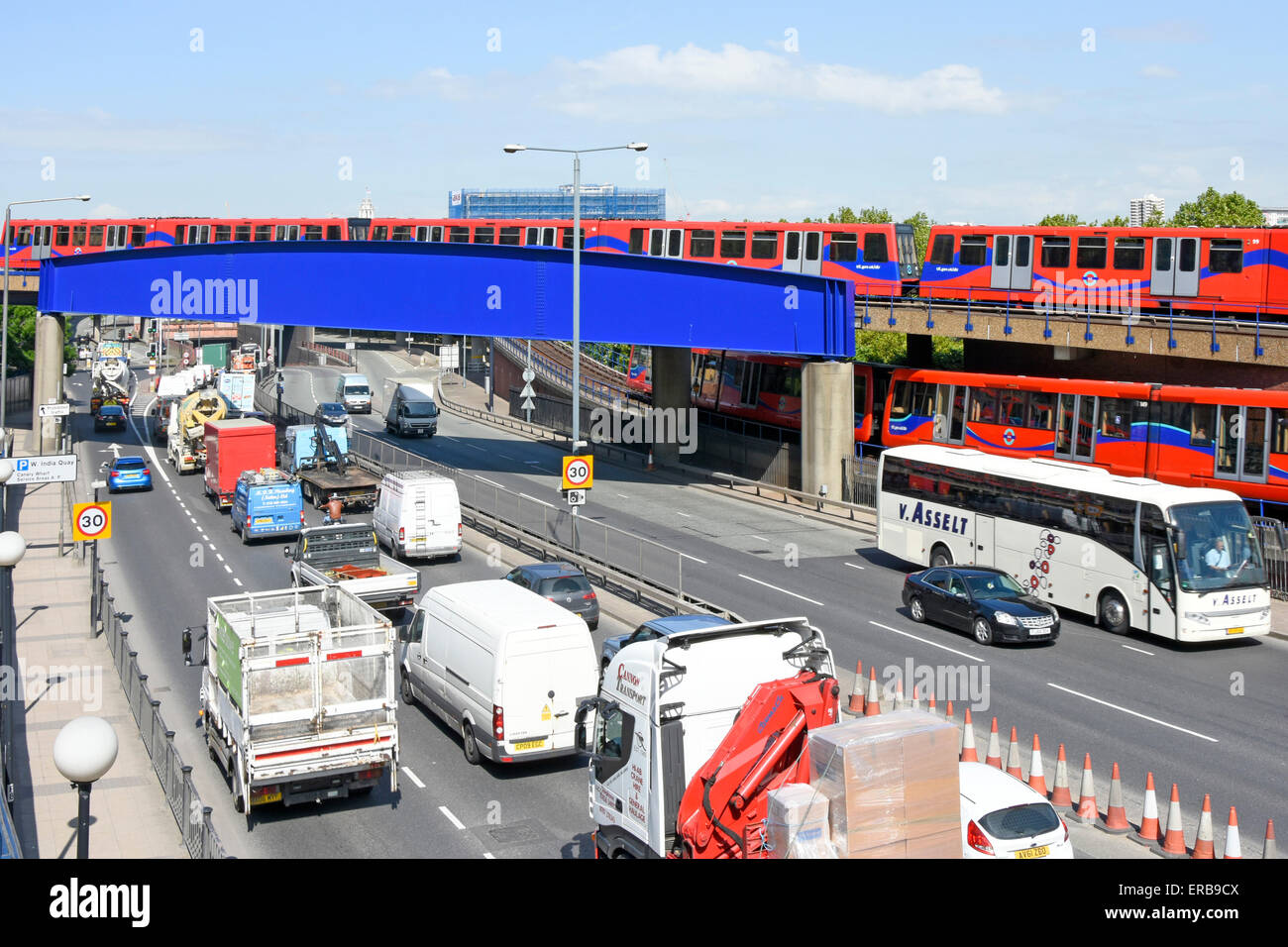 Train Traffic Near Me Traffic Queuing To Enter The Limehouse Link Road Tunnel With Dlr Train On  Bridge Poplar East London England Uk Stock Photo - Alamy