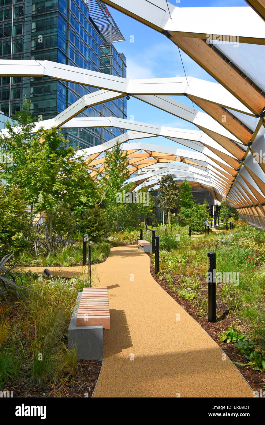 Plants grow Crossrail Place roof garden above Crossrail train station with ETFE roof panels & glulam spruce timber beams Canary Wharf East London UK Stock Photo