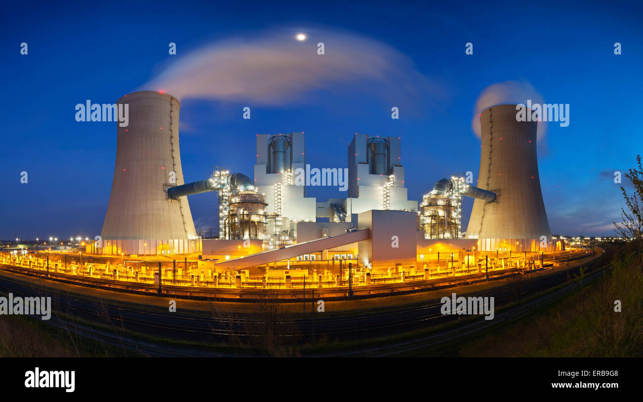 A modern brown coal power station with night blue evening sky. Panoramic wide angle shot. Stock Photo