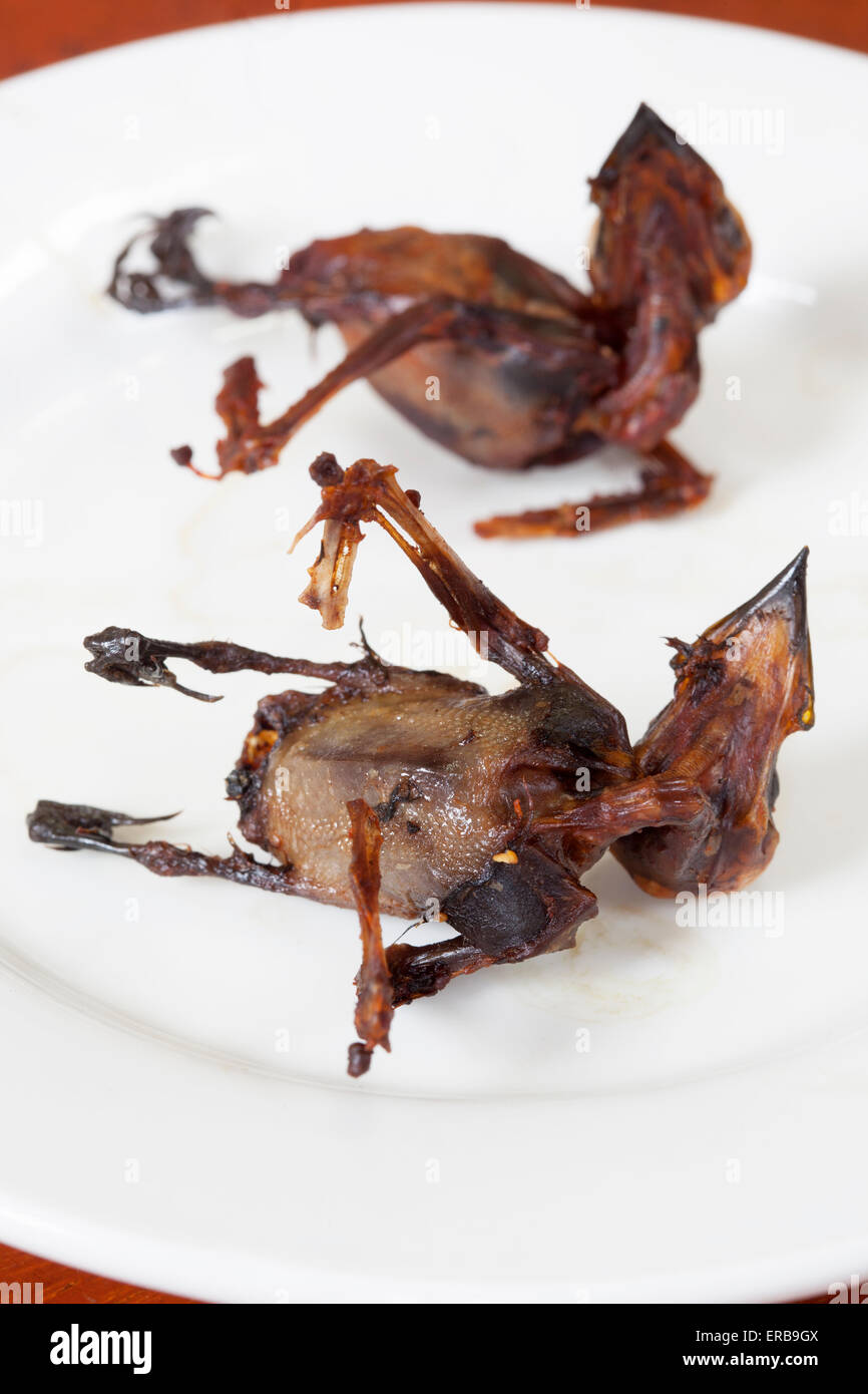 Fried or cooked songbird on sale at market in Phnom Penh Cambodia Stock Photo