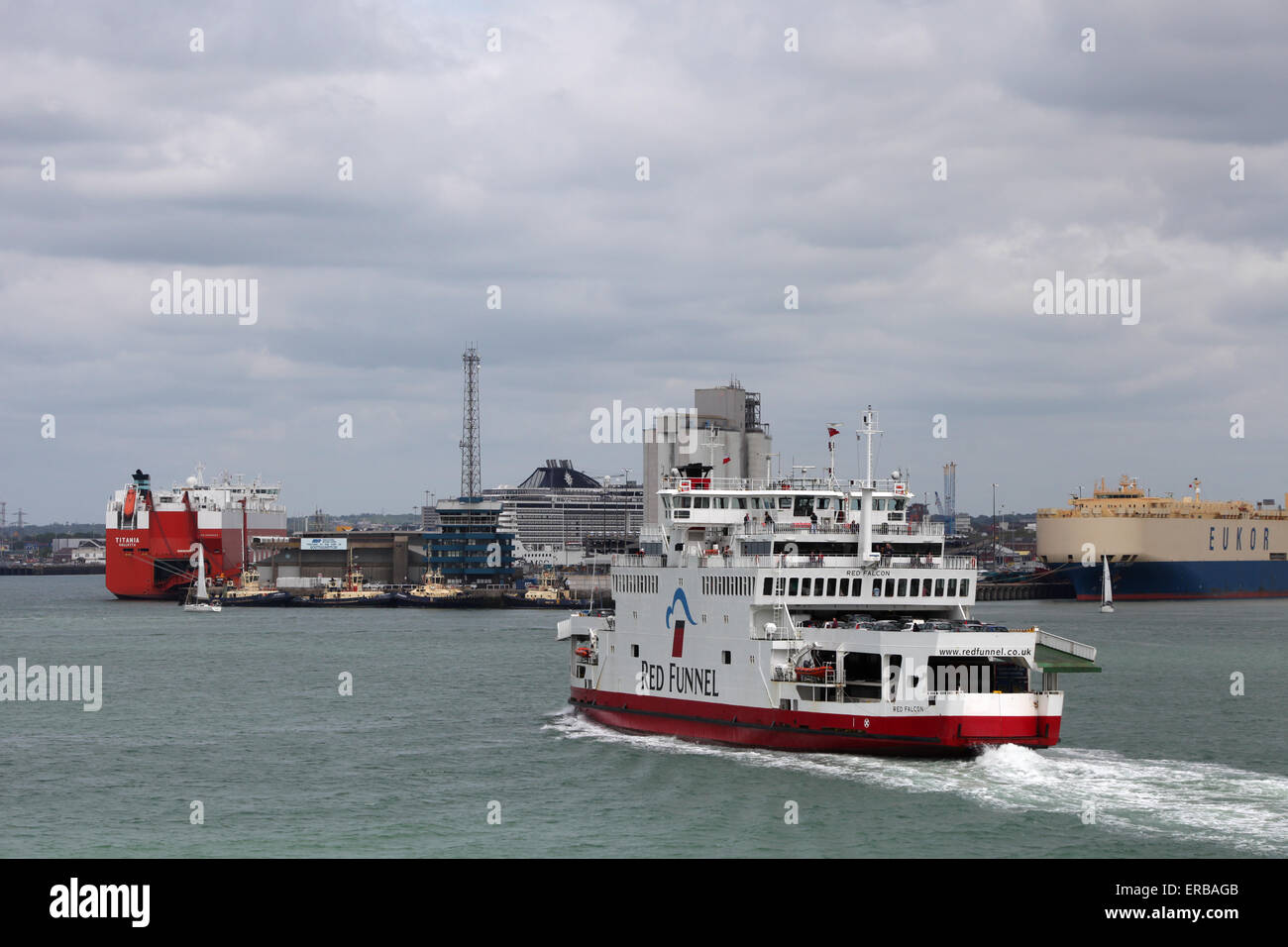 Red Funnel Ferry Red Falcon sailing down Southampton Water with Southampton Docks in the background Stock Photo