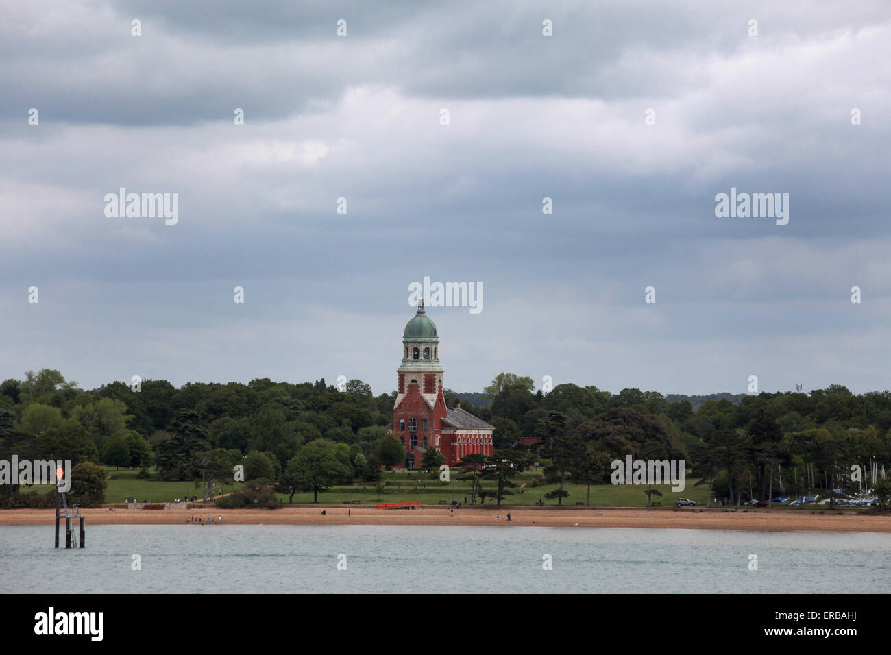 Tower of the former hospital at Royal Victoria Country Park in Netley Hampshire with Southampton water in the foreground Stock Photo