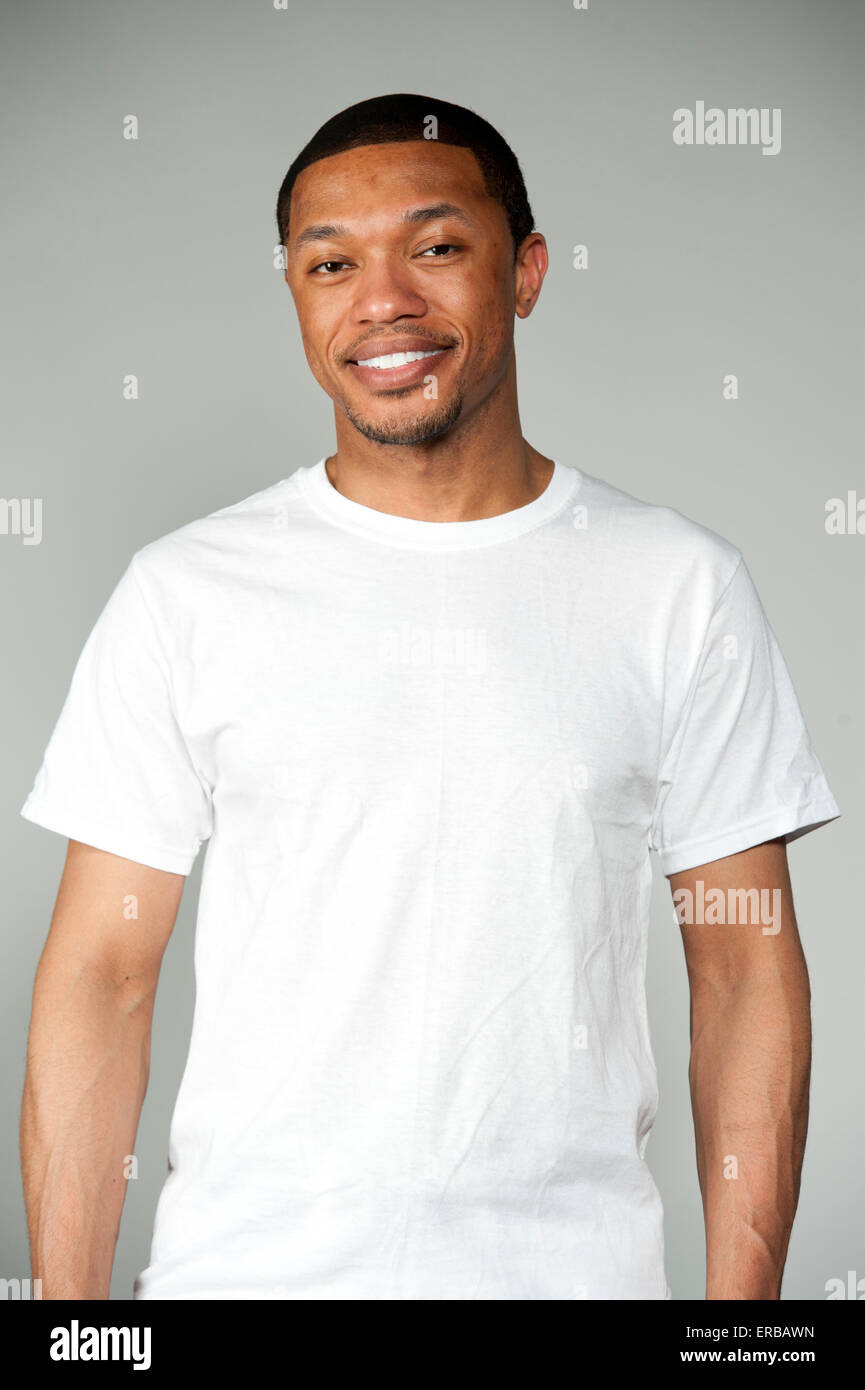 Happy black man white shirt hi-res stock photography and images - Alamy
