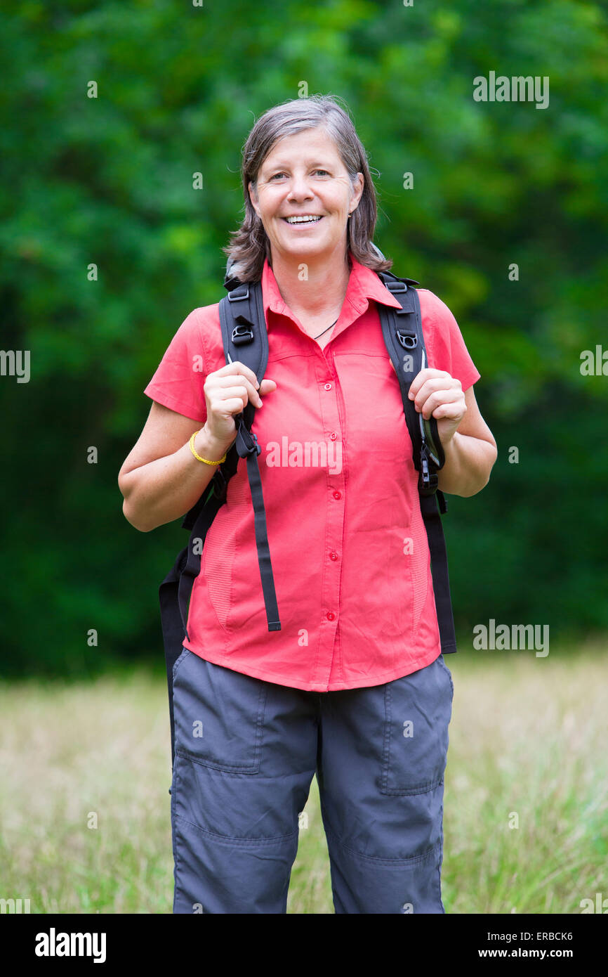 Older woman walking in forest hi-res stock photography and images - Alamy