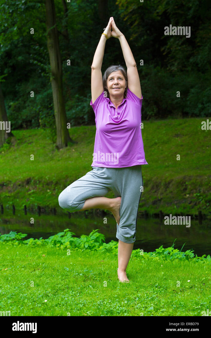 Older woman in park hi-res stock photography and images - Alamy