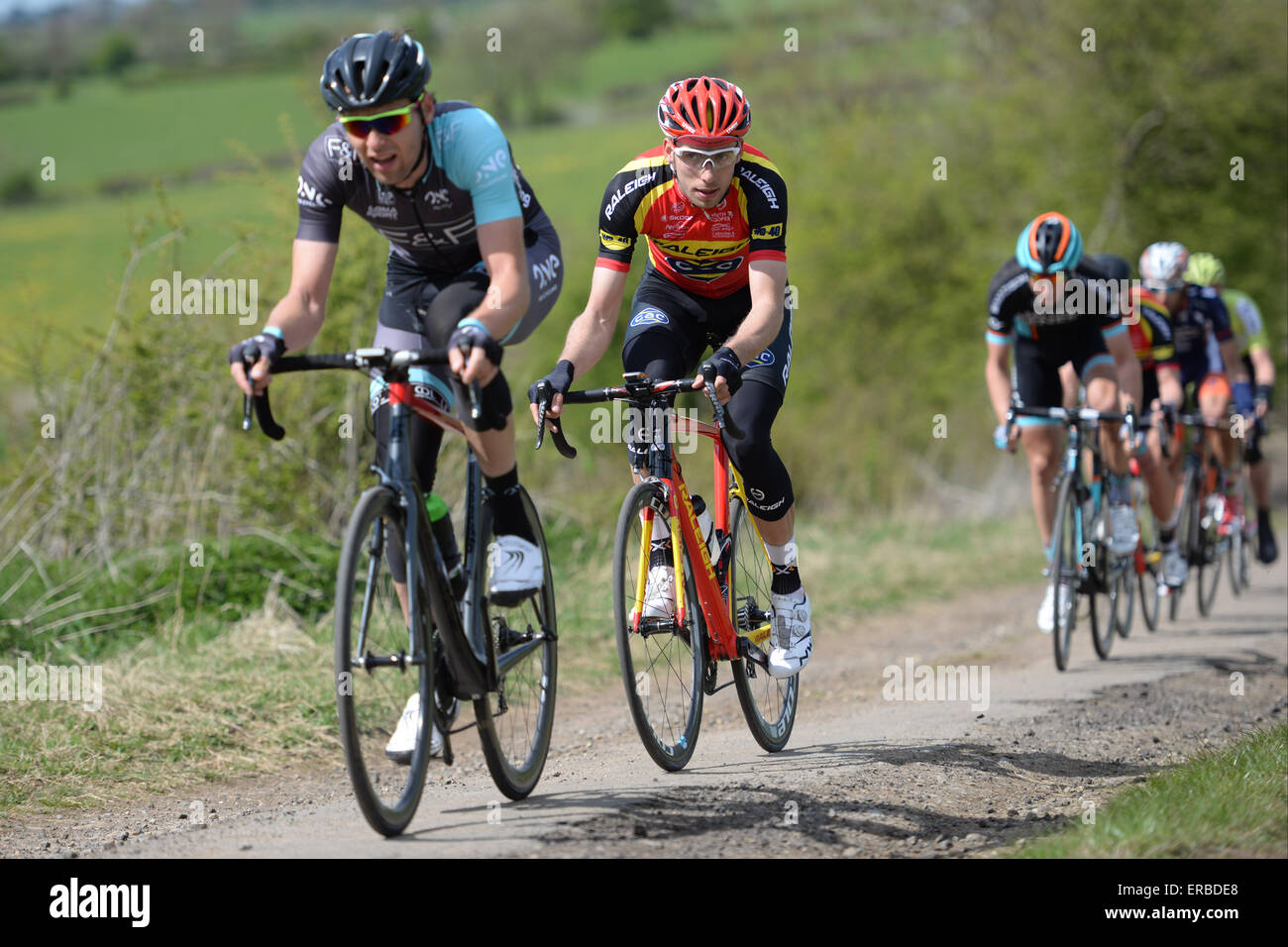 Karol Domagalski (in red) follows Marcin Bialoblocki (front) in the Cicle Classic International at Oakham, UK on 26 April 2015 Stock Photo