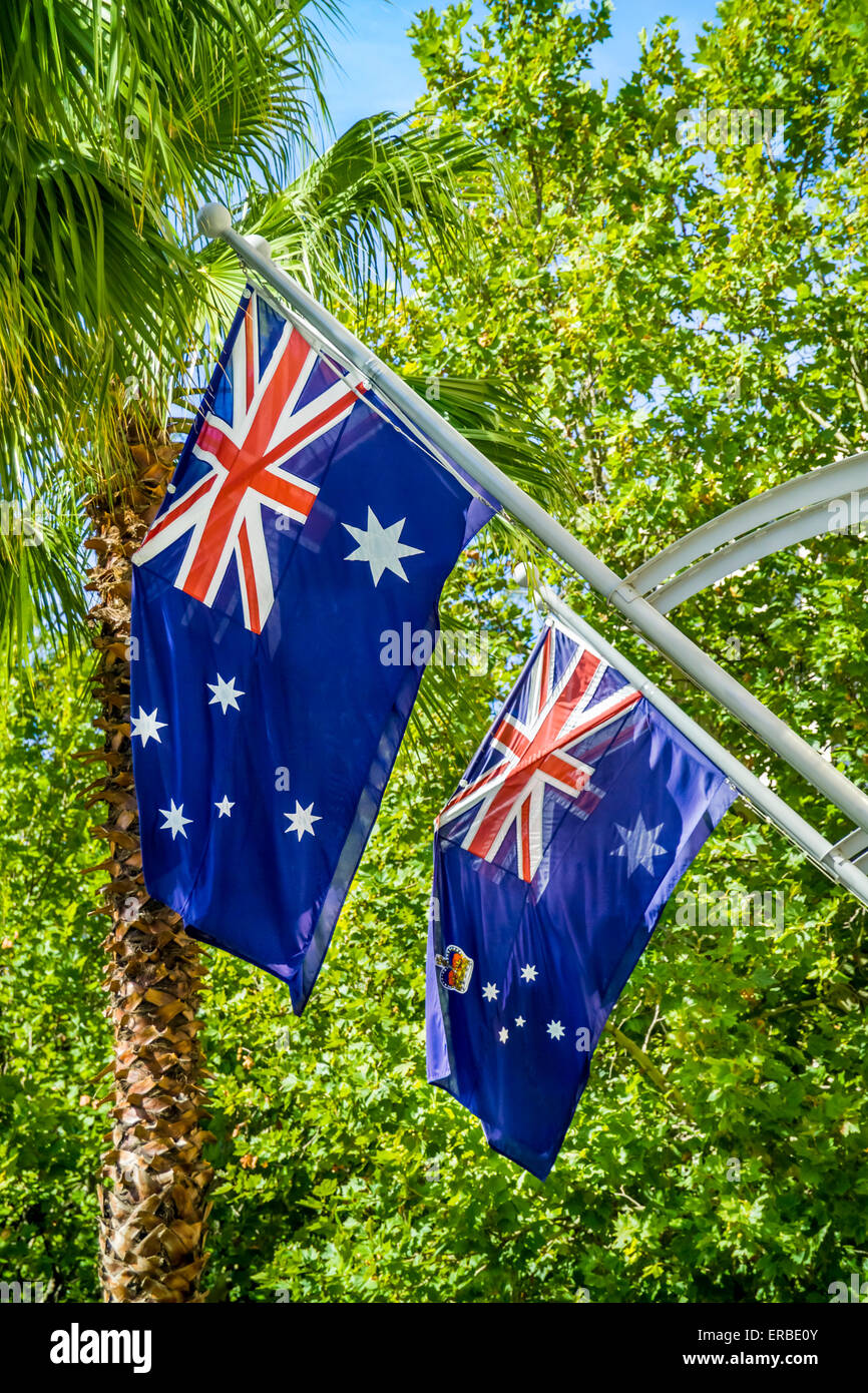 Close up view of two Australian flags hanging outside Department of