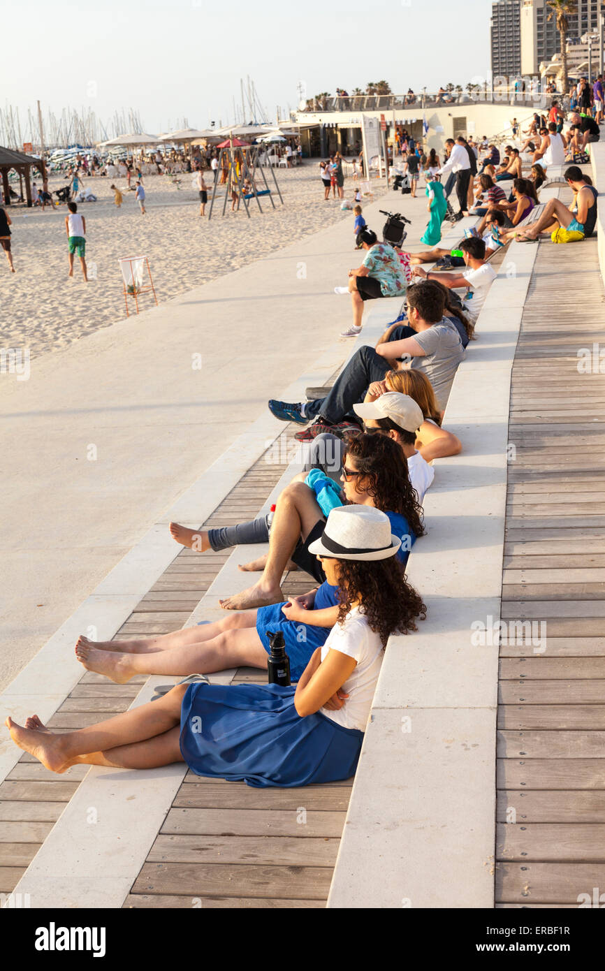 people sitting along Tel Aviv seafront , Israel Stock Photo