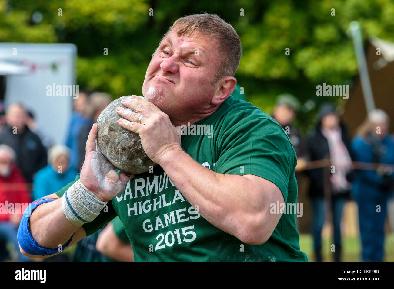 Glasgow, Scotland, UK. 31st May, 2015. Neil Elliott from Shettleston Glasgow, a competitor, taking part in the 'Stone Putt' competition of Carmunnock Highland Games. This is a traditional competition of Scottish Highland Games where a stone weighing from 16 lbs to 26 lbs is thrown as far as possible. Credit:  Findlay/Alamy Live News Stock Photo