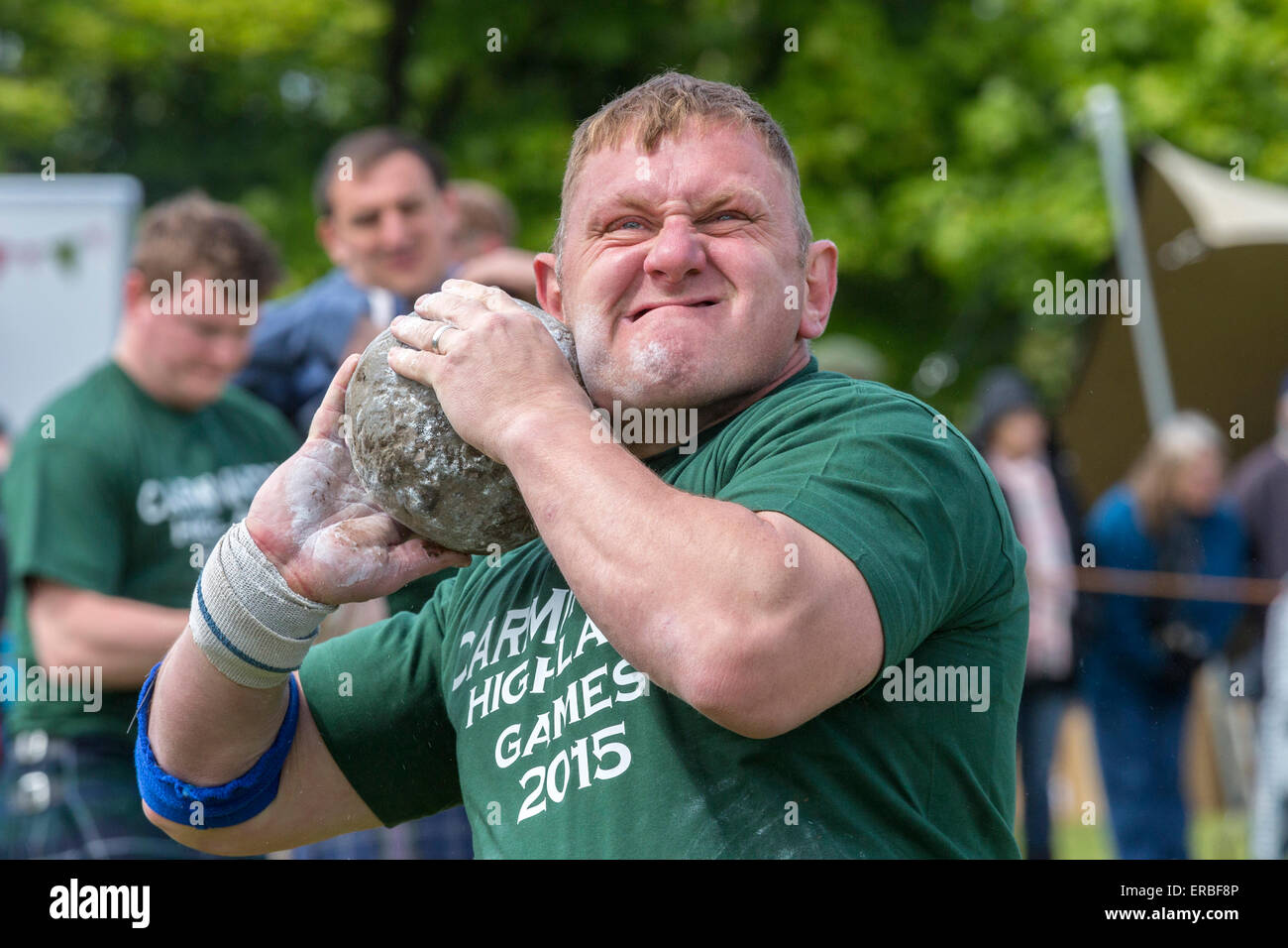Glasgow, Scotland, UK. 31st May, 2015. Neil Elliott from Shettleston Glasgow, a competitor,  taking part in the 'Stone Putt' competition of Carmunnock Highland Games. This is a traditional competition of Scottish Highland Games where a stone weighing from 16 lbs to 26 lbs is thrown as far as possible. Credit:  Findlay/Alamy Live News Stock Photo