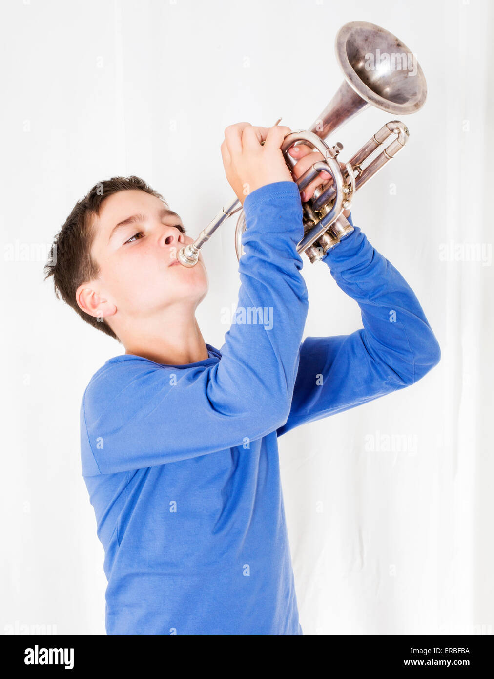 kid playing trumpet