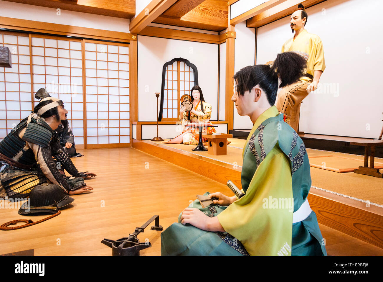 Interior of the keep at Kiyosu castle in Nagoya. Reconstructed scene, courtiers kneeling in front of the Daimyo, warlord, during an audience. Stock Photo