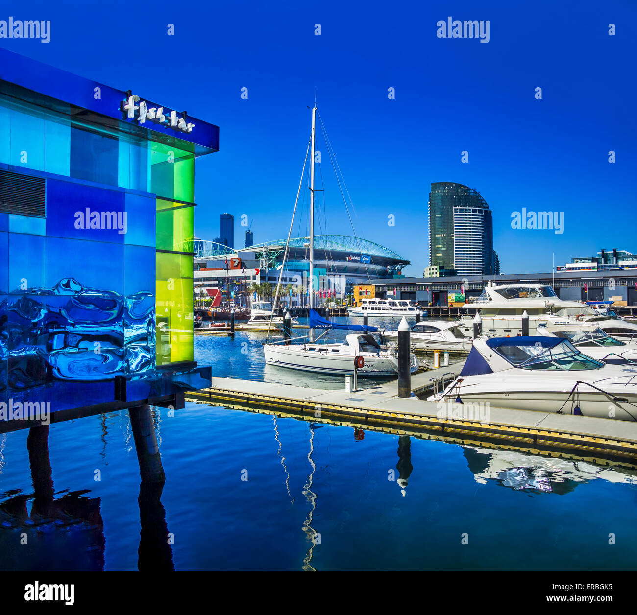 Bright blue colourful Fish bar and yachts in Docklands Marina, Melbourne Australia Stock Photo