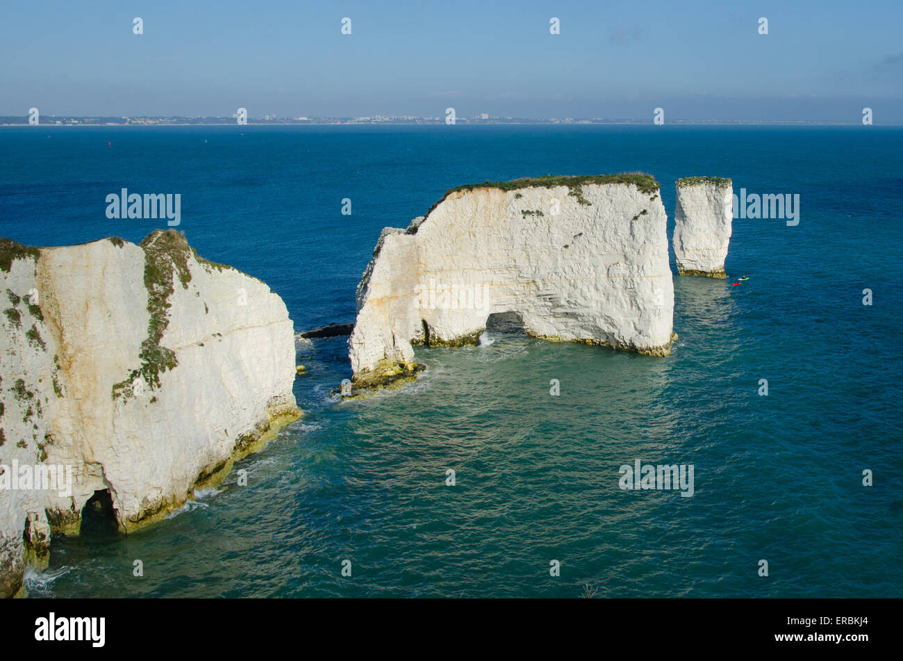 Chalk cliffs at Old Harry Rocks, Swanage, Dorset, UK. Two sea kayaks