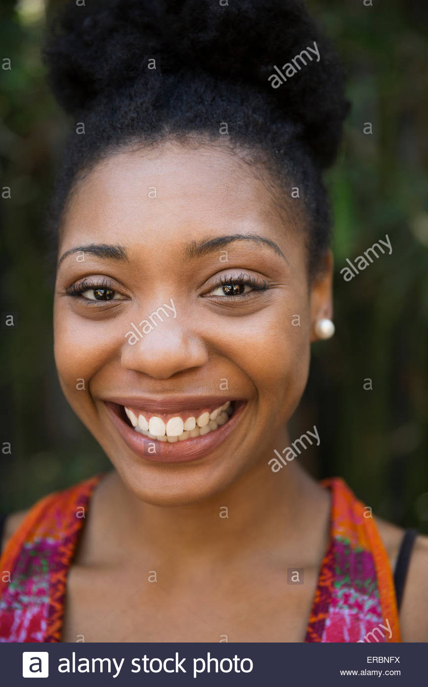 Close up portrait smiling woman with black hair Stock Photo - Alamy