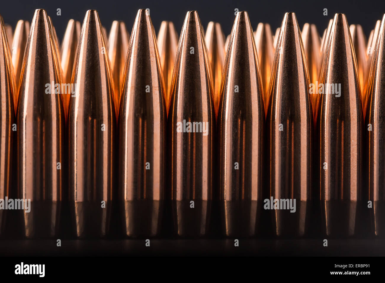 Macro shot of copper bullets that are in many row Stock Photo