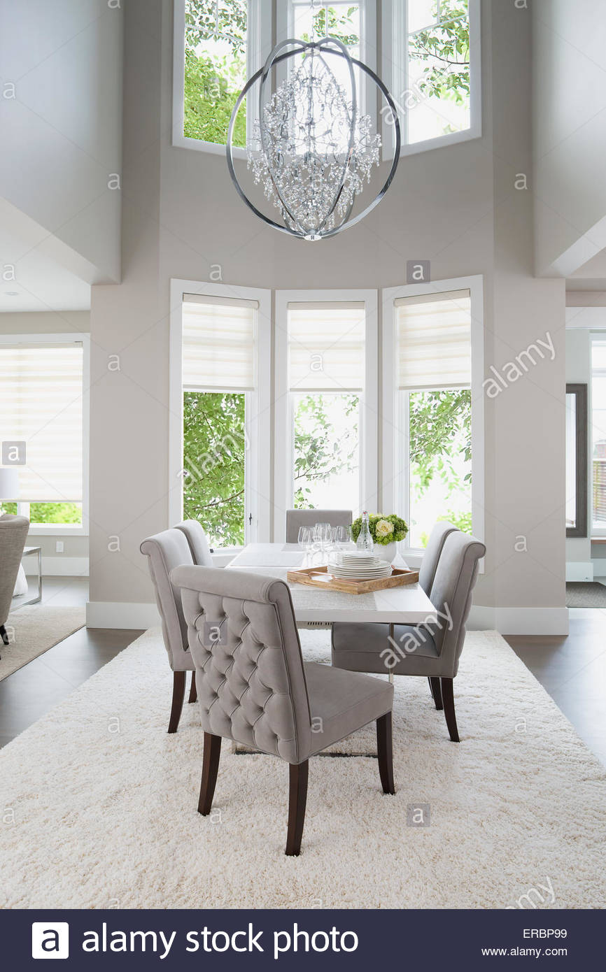 Vaulted Ceiling Chandelier Hanging Over Elegant Dining Table Vaulted Ceiling Chandelier Hanging Over Elegant Dining Table