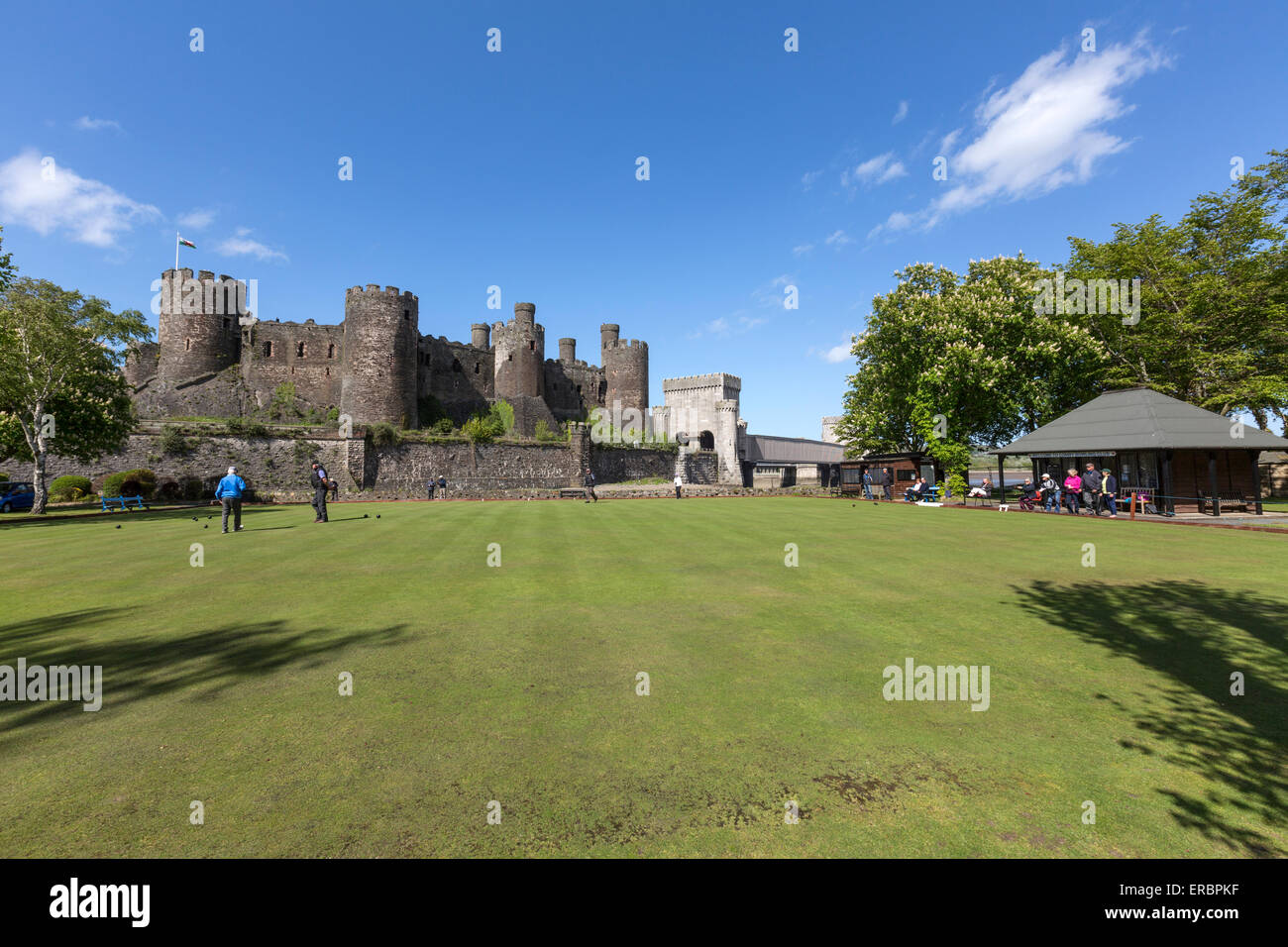 Conwy Castle and people playing lawn bowling Stock Photo