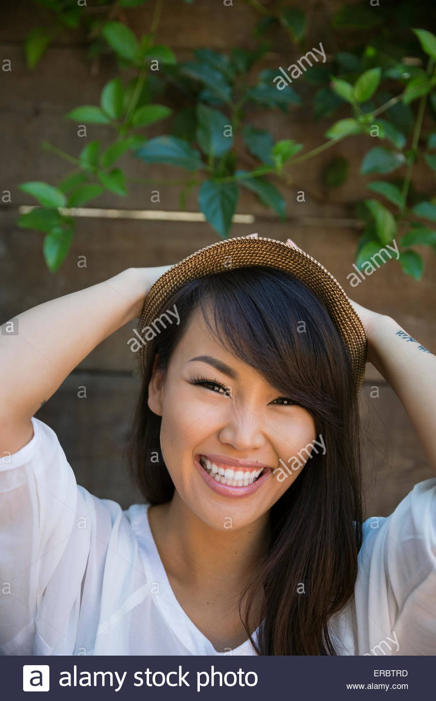 Smiling asian woman wearing hat hi-res stock photography and images - Alamy