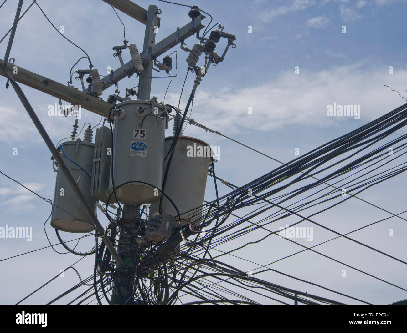 Chaotic electricity supply cables tangled in posts in Boracay