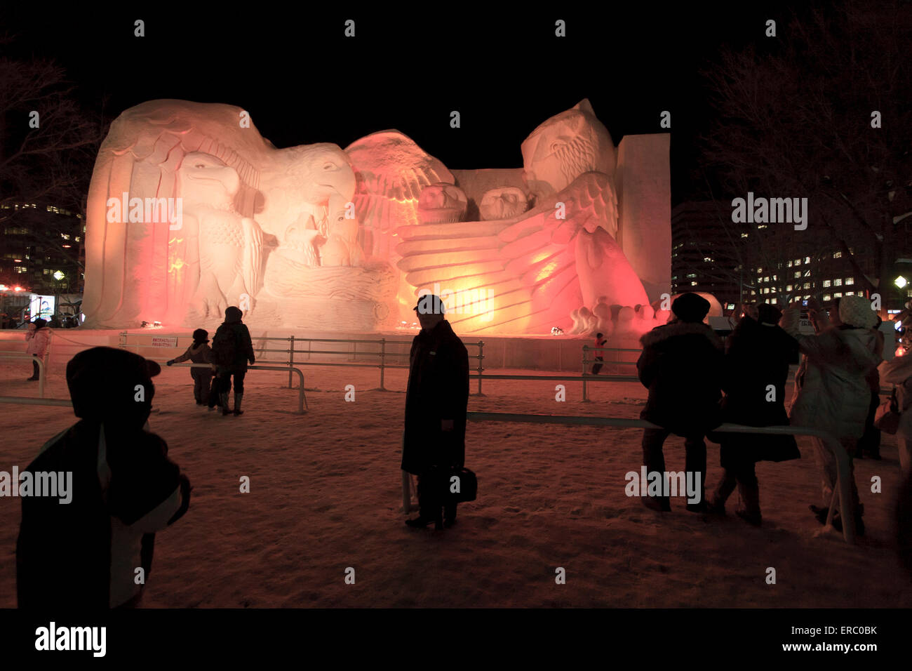 Families come to enjoy the illuminated giant snow sculptures at the