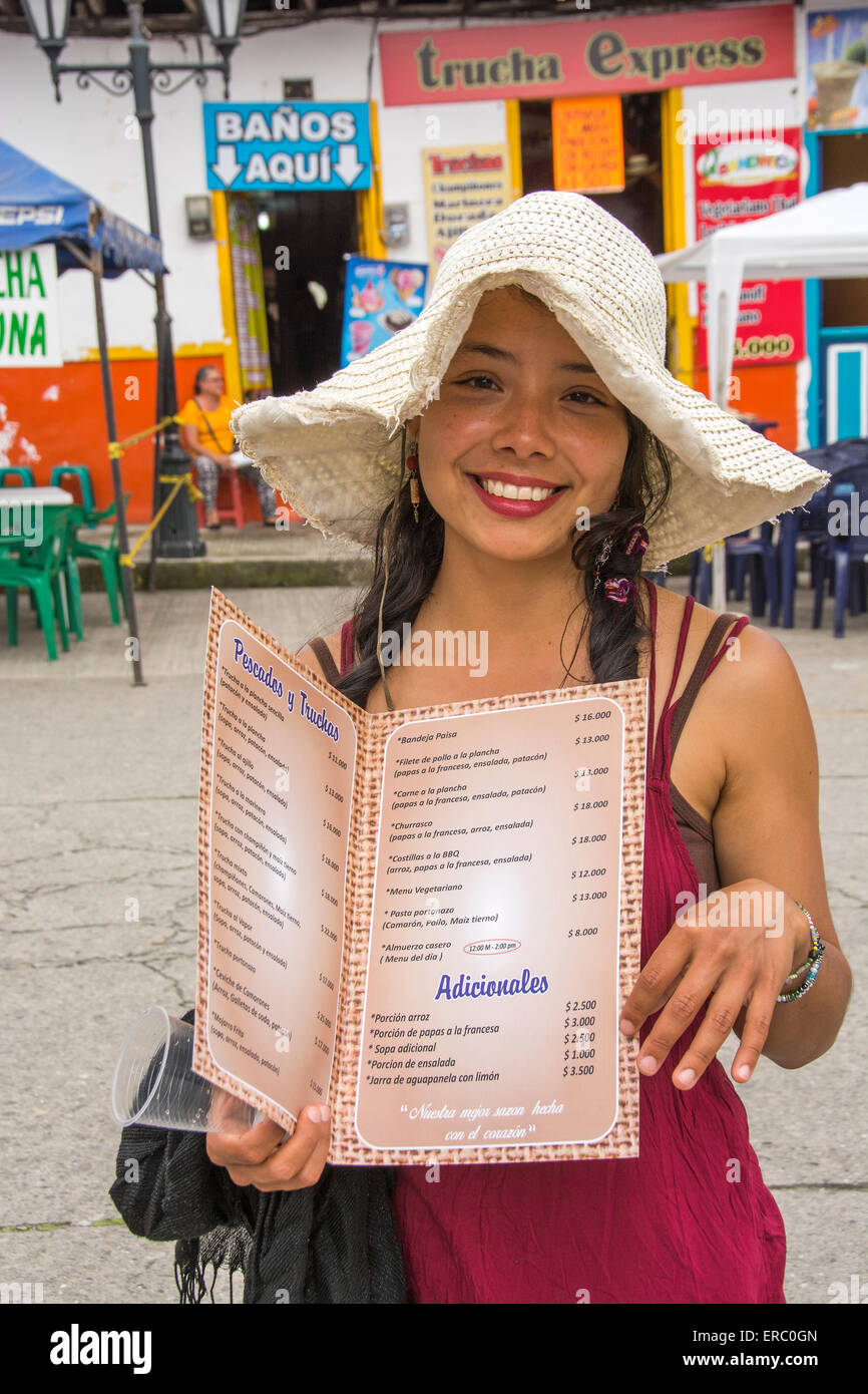 A young girl in Salento, Colombia trying to persuade a group of people
