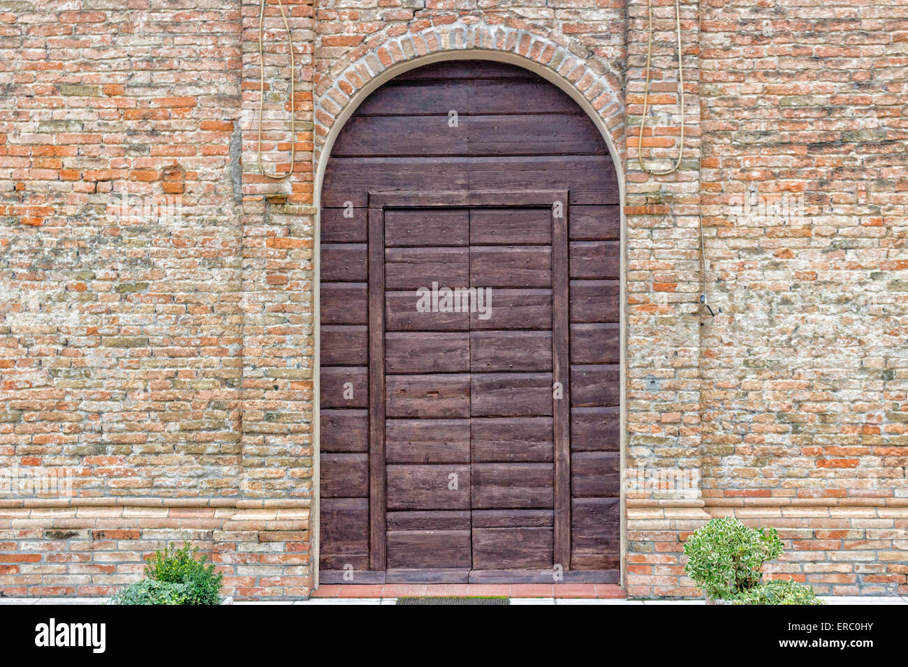 Brickwall facade of the XVI century church dedicated to The Ascension of Jesus Christ in the village of Ascensione near Ravenna in the countryside of Emilia Romagna in Italy: it dates back to 1534 Stock Photo