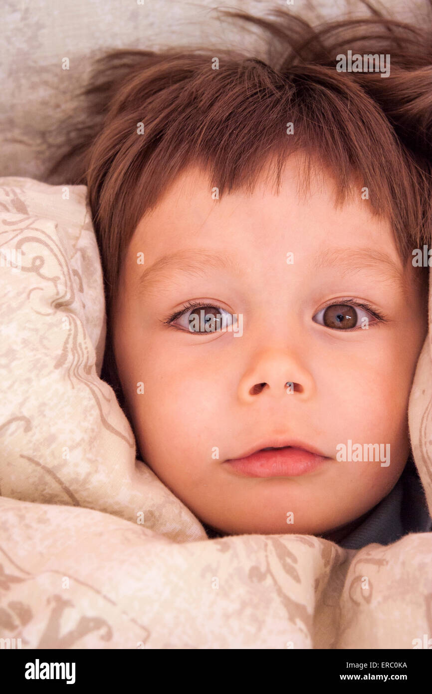 2 4 Year Old Caucasian Child Boy In Bed Head On Pillow Duvet