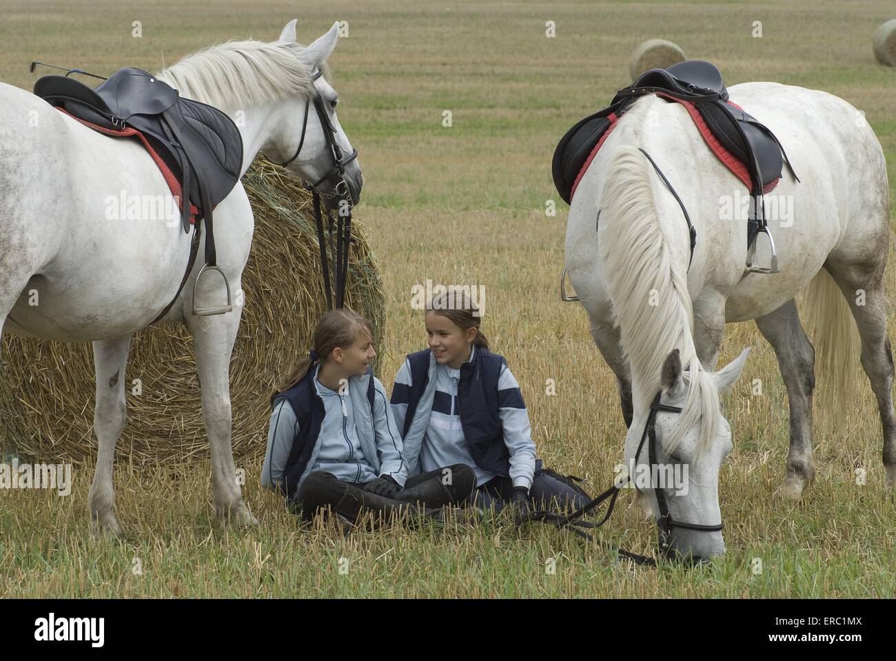 girls with horses Stock Photo